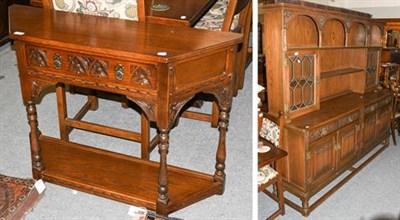 Lot 1363 - An Old Charm oak dining room suite comprising a drawer leaf dining table, eight chairs...