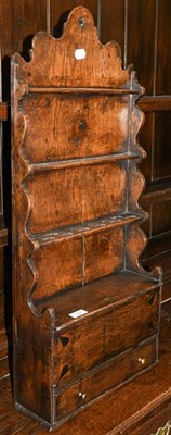 Lot 1367 - An 18th century oak spoon rack, 94cm high