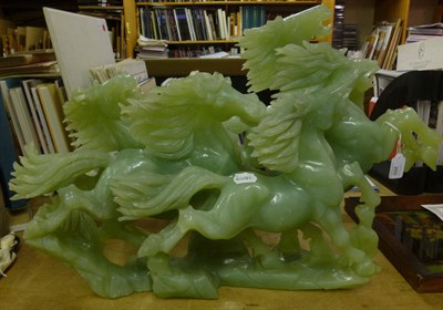 Lot 260 - A Jade Centrepiece, 20th century, modelled as five galloping horses on a rocky moulded base,...