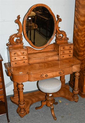 Lot 1371 - A Victorian satinwood Duchess dressing table with carved scrolling mirror supports, raised on...