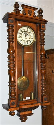 Lot 1376 - A Vienna type walnut veneered double weight striking wall clock, circa 1890