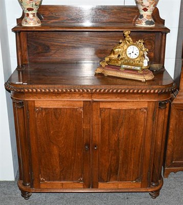 Lot 1380 - A William IV rosewood chiffonier with gadrooned mouldings, column supports, raised on dart...