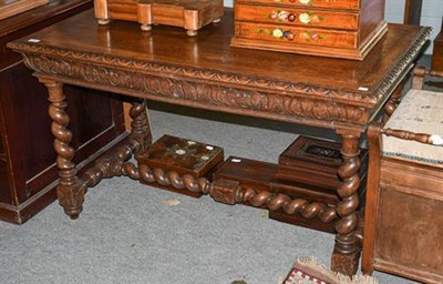 Lot 1382 - ~A Victorian carved oak side table on boldly turned supports