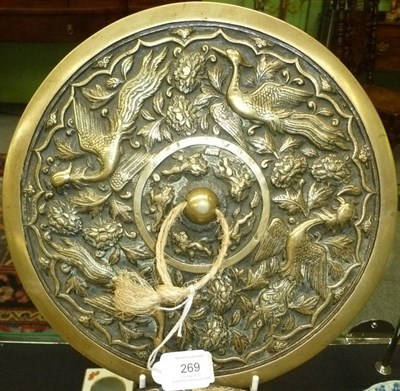 Lot 269 - A Chinese Circular Bronze Mirror, 19th century, cast with mythical birds and peonies, with an...