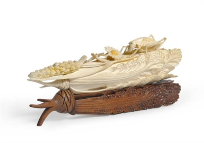 Lot 274 - A Chinese Ivory Carving of a Grasshopper upon a Cabbage, early 20th century, naturalistically...