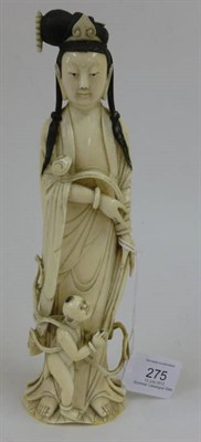 Lot 275 - A Chinese Carved Ivory Figure of Guanyin, 20th century, with her black hair tied up and held with a