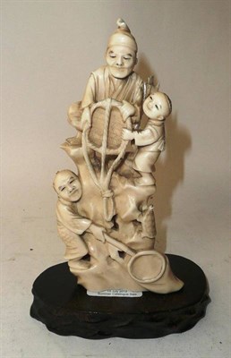 Lot 286 - A Japanese Marine Ivory Okimono, Meiji period (1868-1912), as two fishermen and a child with...