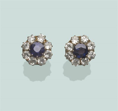 Lot 589 - A Pair of Sapphire and Diamond Cluster Stud Earrings, the round mixed cut sapphires within a border