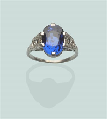 Lot 666 - An Art Deco Sapphire and Diamond Ring, the oval mixed cut sapphire in a white claw setting...