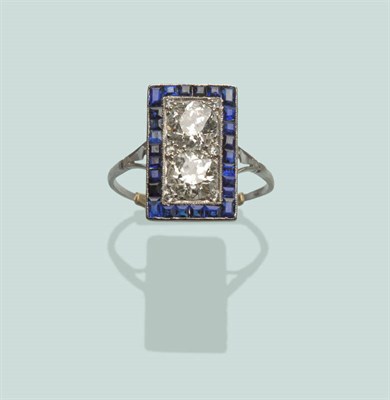 Lot 671 - An Art Deco Diamond and Sapphire Ring, two old brilliant cut diamonds within a white millegrain...
