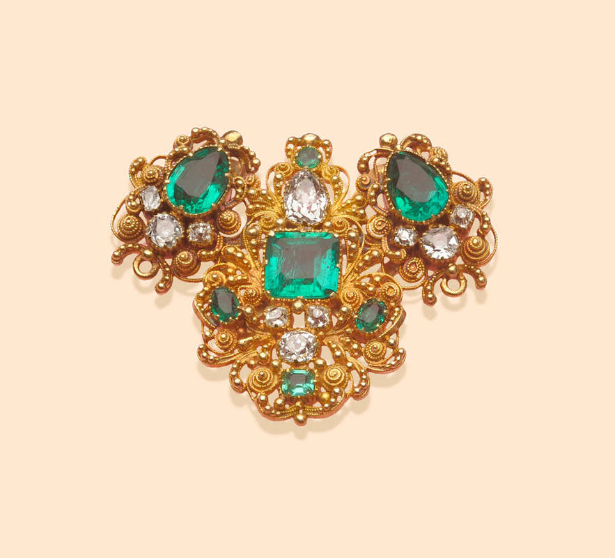 Lot 709 - An Emerald and Diamond Brooch, the principal stones include two pear cut emeralds, a square...