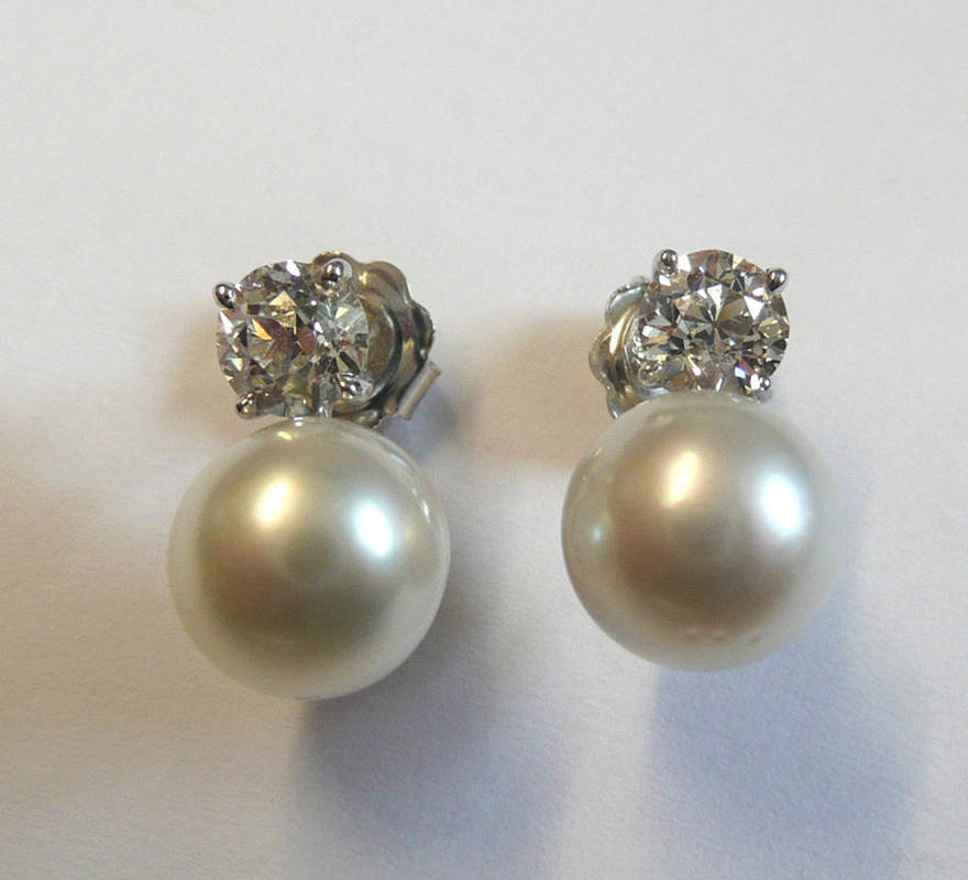 Lot 768 - A Pair of 18 Carat White Gold Diamond and Cultured Pearl Earrings, each old brilliant cut...