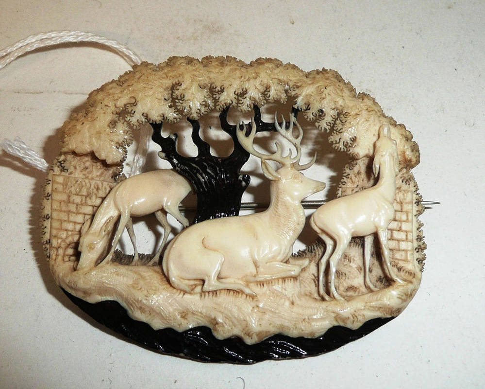 Lot 968 - A German Ivory Brooch, circa 1860, in the style of Count von Erbach-Erbach, depicting a stag...