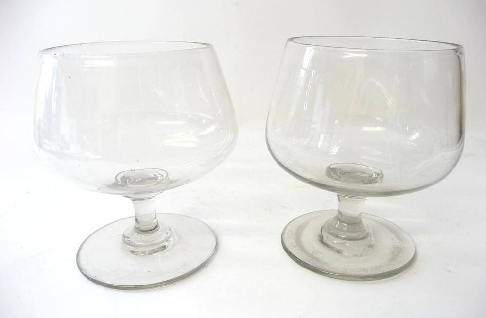 Lot 1 - A Pair of Brandy Balloons, early 19th century, the ogee bowls on waisted stems and circular...