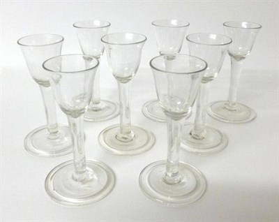 Lot 8 - A Set of Eight Cordial Glasses, mid 18th century, the bell shaped bowls on plain stems and...