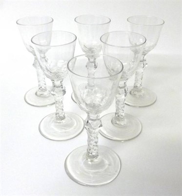 Lot 9 - A Set of Six Wine Glasses, circa 1770, the ogee bowls on knopped faceted stems, 14.5cm high