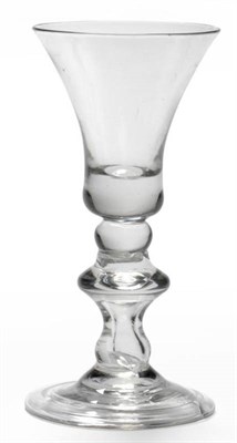 Lot 11 - A Baluster Wine Glass, circa 1720, the waisted bell bowl with solid base on a composite stem...