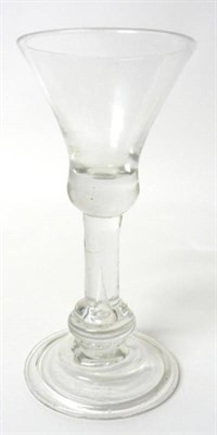 Lot 12 - A Wine Glass, circa 1720, the waisted bell bowl with solid base on a plain stem with annulated...
