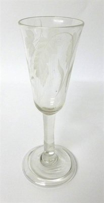 Lot 13 - An Ale Glass, circa 1740, the rounded funnel bowl engraved with hops and barley on a plain stem and