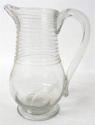 Lot 34 - A Glass Large Jug, 2nd half 18th century, of inverted baluster form with trailed ribbing to the...