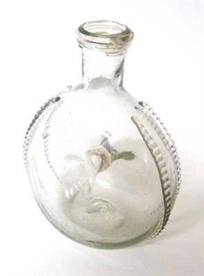 Lot 36 - A Glass Flattened Ring Flask, probably English, late 17th century, with spiral trailed rim...