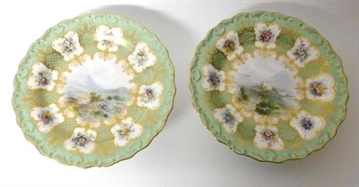 Lot 68 - A Pair of Royal Worcester Porcelain Cake Stands, 1902, painted by Harry Davis with named views...