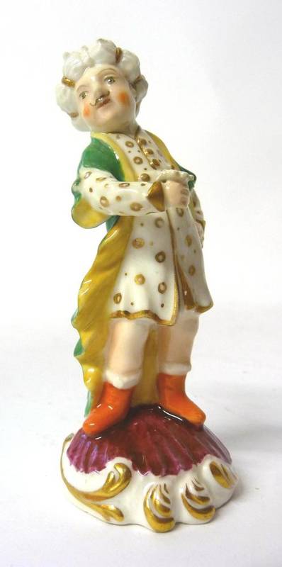 Lot 98 - A Rockingham Porcelain Figure of a Turk, circa 1830, standing, wearing an orange and white...