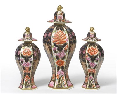 Lot 101 - A Garniture of Three Rockingham Porcelain Hexagonal Vases and Covers, 1826-30, with rose knops,...