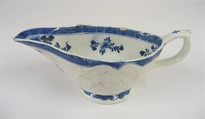 Lot 135 - A Derby Porcelain Sauceboat, circa 1770, the interior painted in underglaze blue with...