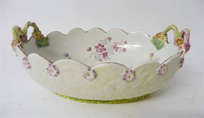 Lot 138 - A Derby Porcelain Basket, circa 1760, of shaped oval form with twin handles, painted in colours...