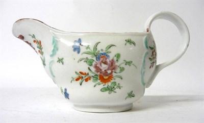Lot 144 - A Champions Bristol Porcelain Sauce Boat, circa 1770, of ogee oval form moulded with feather...