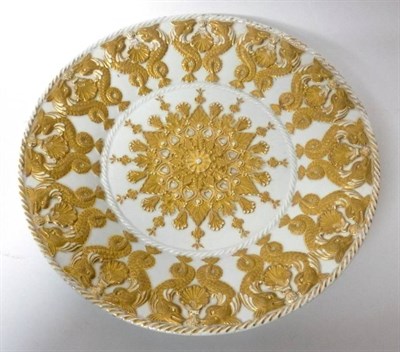 Lot 168 - A Meissen Porcelain Dish, circa 1900, moulded in relief and gilt with a central foliate boss within