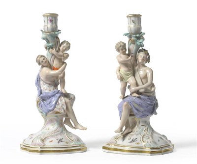 Lot 169 - A Pair of Meissen Porcelain Figural Candlesticks, late 19th/early 20th century, one modelled with a