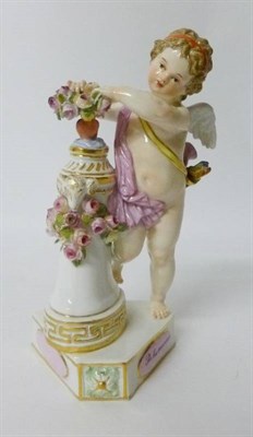 Lot 182 - A Meissen Porcelain Figure of Cupid  "Je Les Couronne ", late 19th/early 20th century, the...