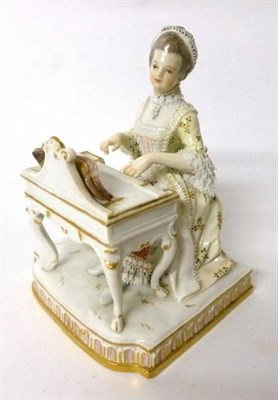 Lot 183 - A Meissen Porcelain Figure of a Lady, 20th century, in 18th century costume sitting at a spinet, on