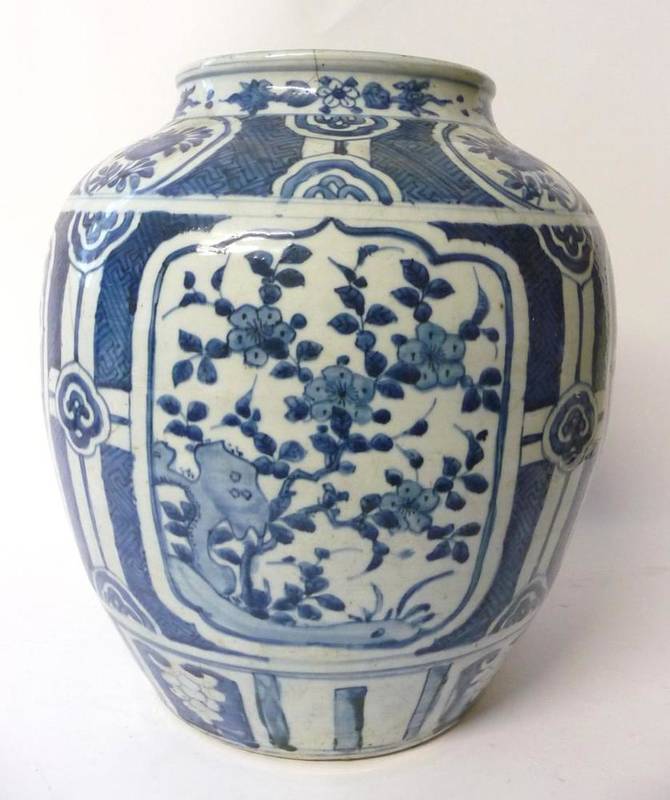 Lot 200 - A Chinese Porcelain Ovoid Jar, mid 17th century, painted in underglaze blue with ogee panels of...