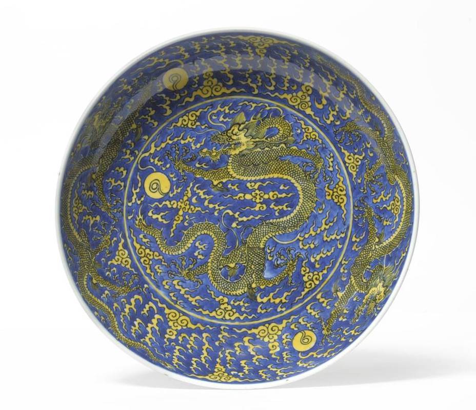 Lot 206 - A Chinese Porcelain Dragon Dish, Kangxi reign mark, painted in underglaze blue and yellow...