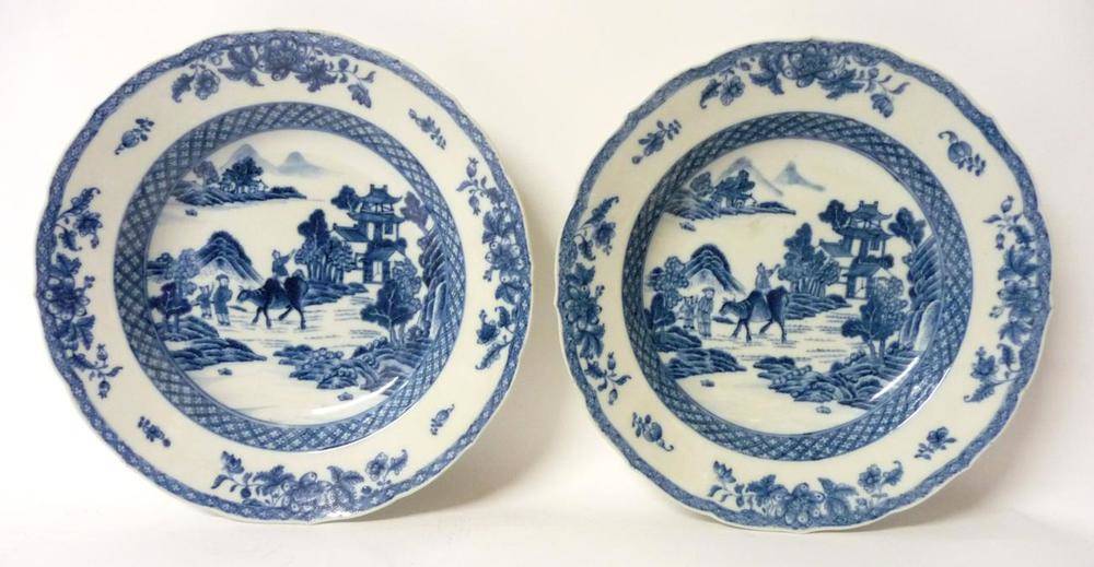 Lot 213 - A Pair of Chinese Porcelain Soup Plates, Qianlong period, painted in underglaze blue with a boy...