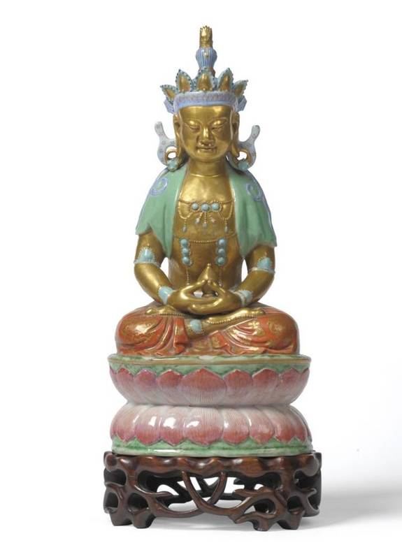 Lot 232 - A Chinese Porcelain Figure of Buddha, 19th century, the seated figure with blue, turquoise and gilt