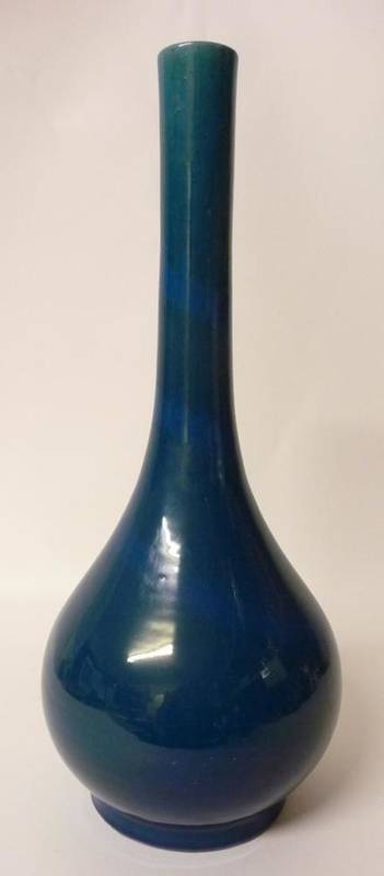 Lot 235 - A Chinese Blue Monochrome Glazed Bottle Vase, Qing dynasty, with wrythen lighter blue...
