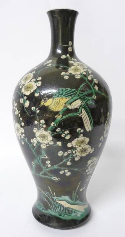 Lot 236 - A Chinese Porcelain Baluster Vase, in Kangxi style, painted in famille noire enamels with birds...