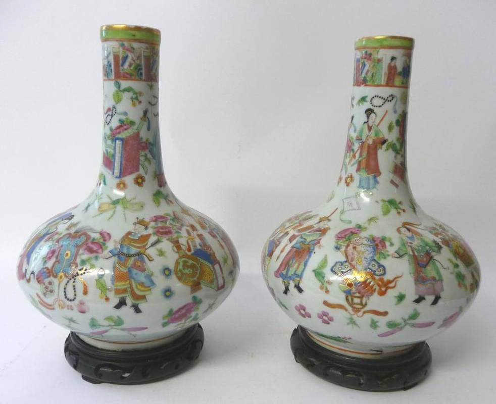 Lot 243 - A Pair of Canton Porcelain Bottle Vases, mid 19th century, painted in famille rose enamels with...