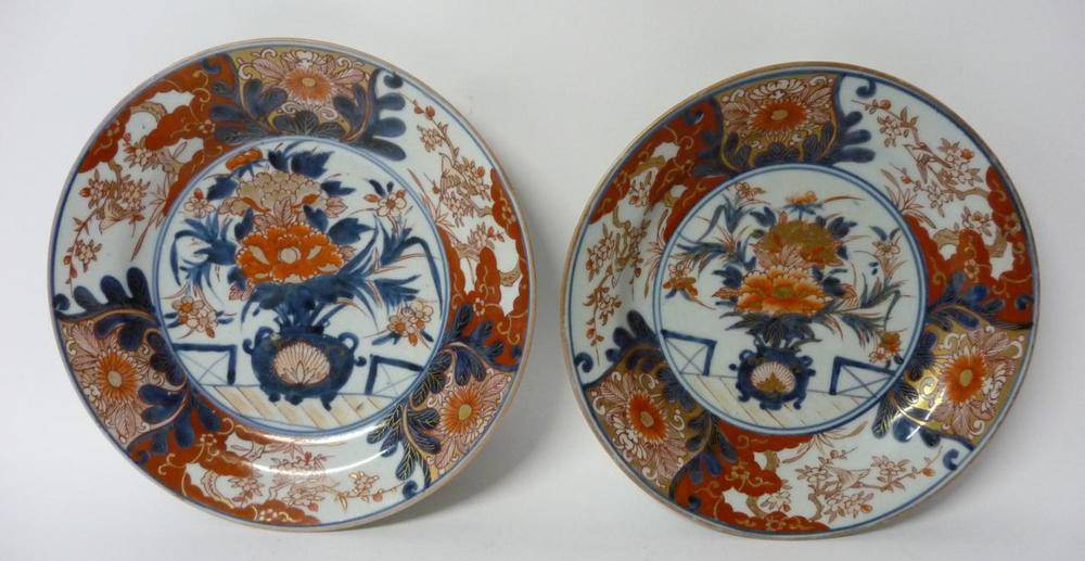 Lot 245 - A Pair of Imari Porcelain Plates, early 18th century, typically painted with a jardinière of...
