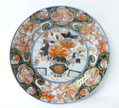 Lot 246 - An Imari Porcelain Circular Dish, early 18th century, typically painted with a jardinière of...