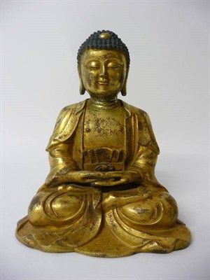 Lot 271 - A Chinese Gilt Bronze Figure of Buddha, 17th/18th century, wearing flowing robes with foliate...