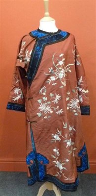 Lot 275 - A Chinese Embroidered Silk Summer Robe, late Qing Dynasty, worked with sprays of summer flowers and