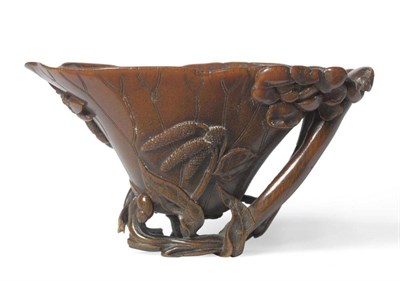 Lot 282 - A Chinese Rhinoceros Horn Libation Cup, 17th/early 18th century, as a lotus leaf, two lotus...