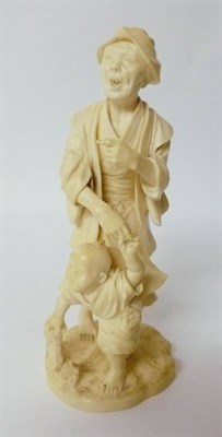 Lot 294 - A Japanese Ivory Okimono as an Old Man, early 20th century, standing in traditional dress,...