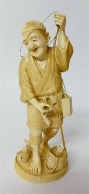 Lot 297 - A Japanese Ivory Okimono as a Fisherman, early 20th century, standing wearing traditional dress...