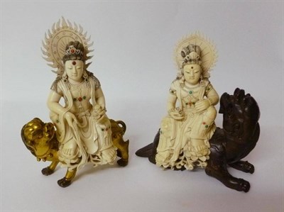 Lot 301 - A Pair of Chinese Ivory Figures of a Goddess, early 19th century, each with a flaming halo, wearing